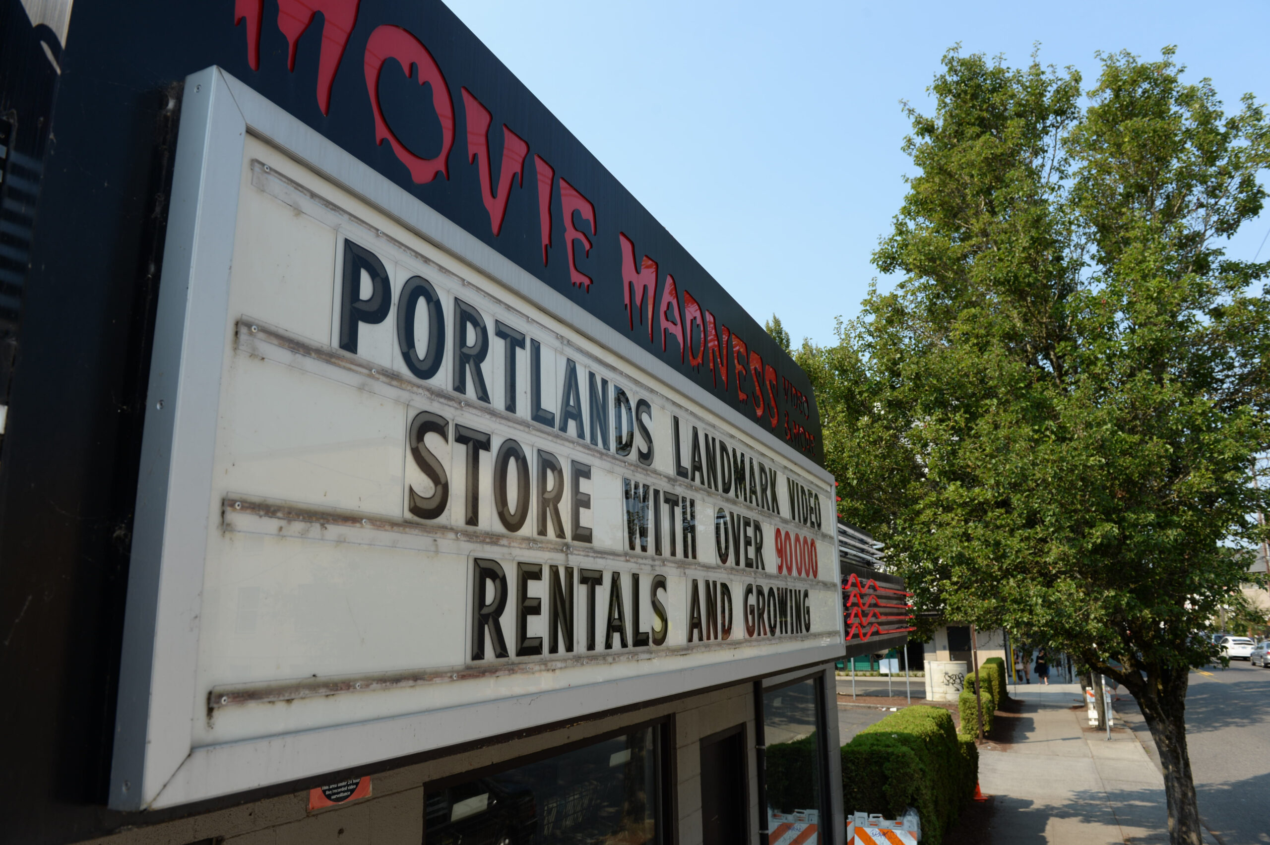 An angled closeup of the Movie Madness marquee.